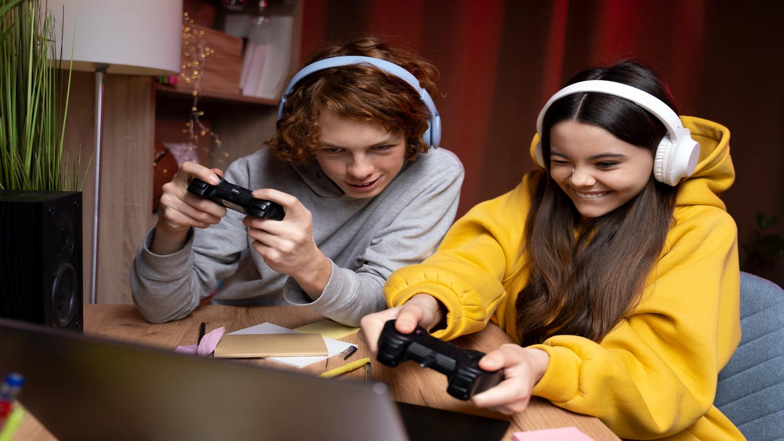 two teenage friends playing video games together